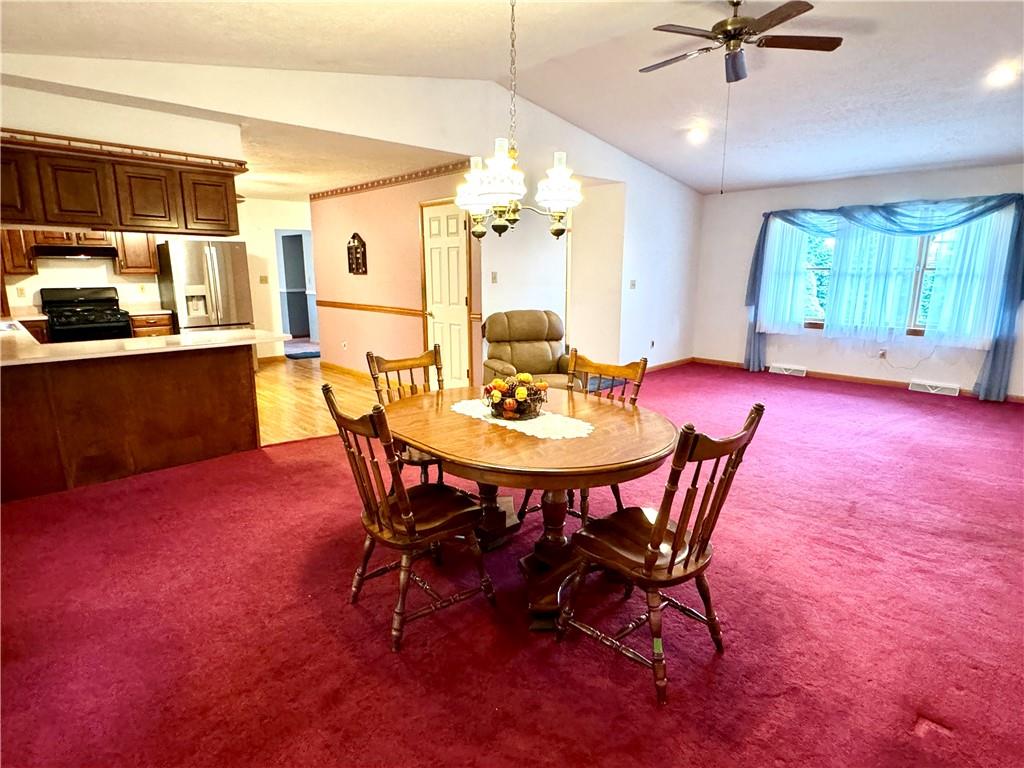 569 Whitestown Road Butler, PA 16001 - Photo 11 of 47 a view of a dining room with furniture and a chandelier