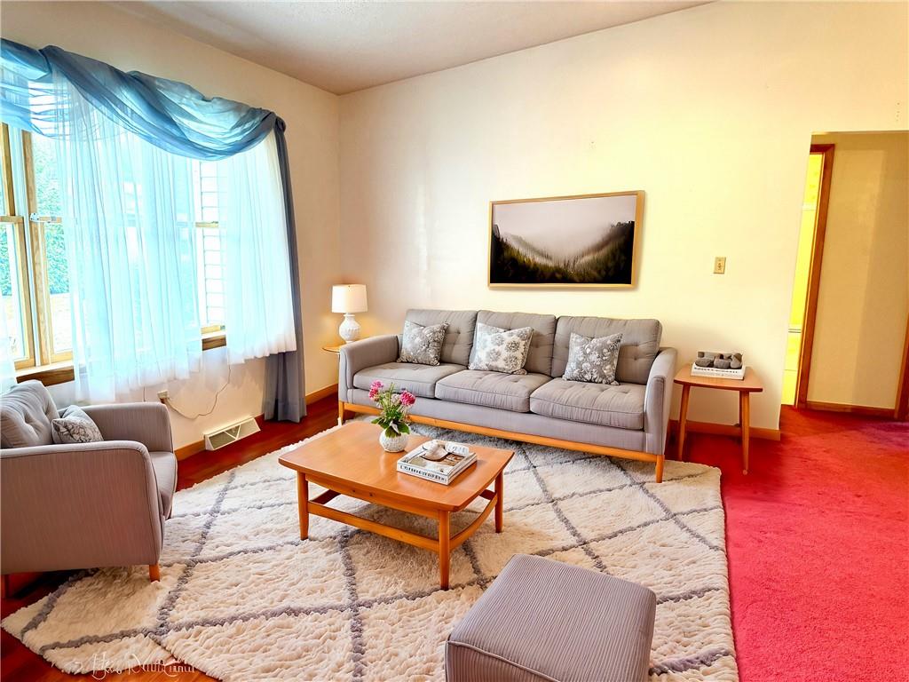 569 Whitestown Road Butler, PA 16001 - Photo 12 of 47 a living room with furniture and a flat screen tv