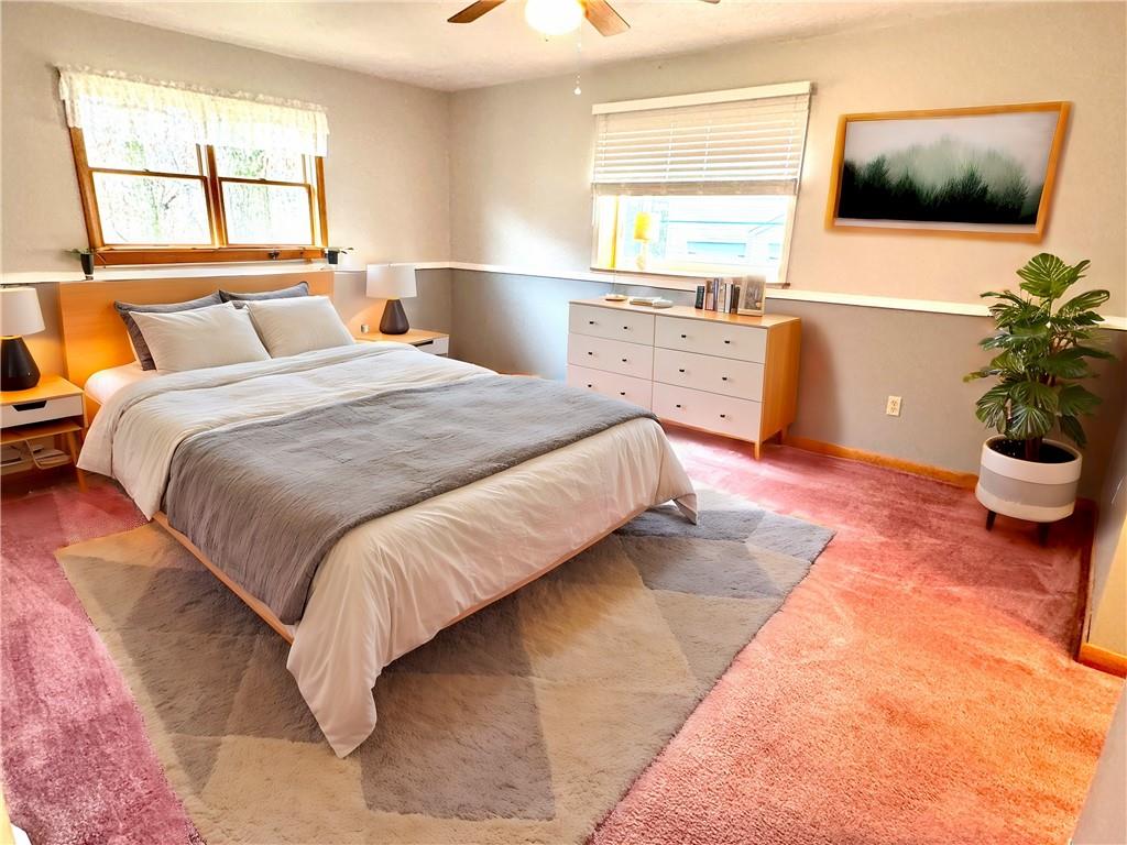 569 Whitestown Road Butler, PA 16001 - Photo 15 of 47 a bedroom with a large bed and a flat tv screen on dresser