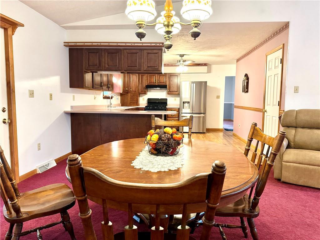 569 Whitestown Road Butler, PA 16001 - Photo 9 of 47 a dining room with furniture and window