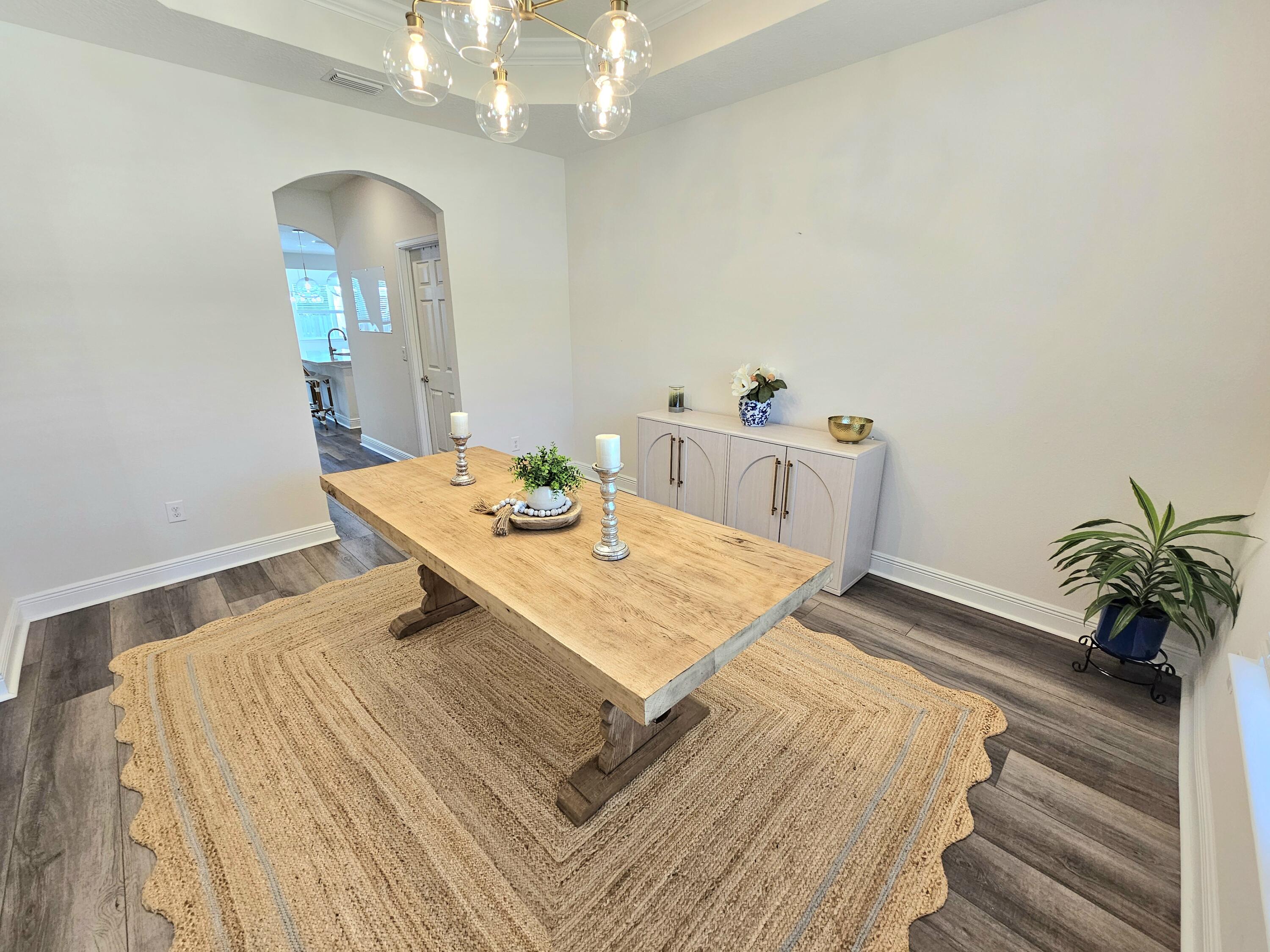 137 Autumn Avenue Freeport, FL 32439 - Photo 18 of 57 a bedroom with a bed and a table in it