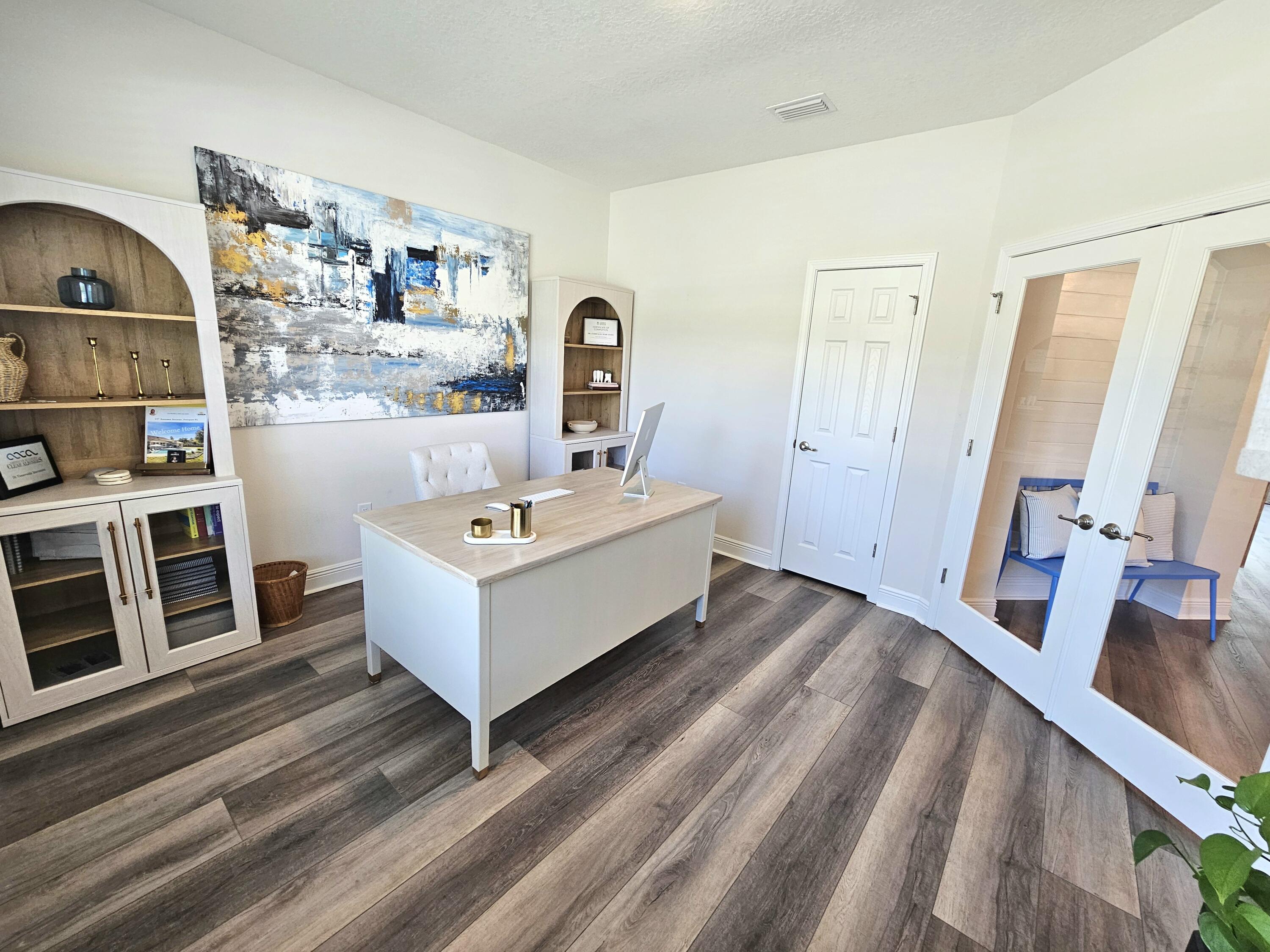 137 Autumn Avenue Freeport, FL 32439 - Photo 23 of 57 a room with a couch and a flat screen tv