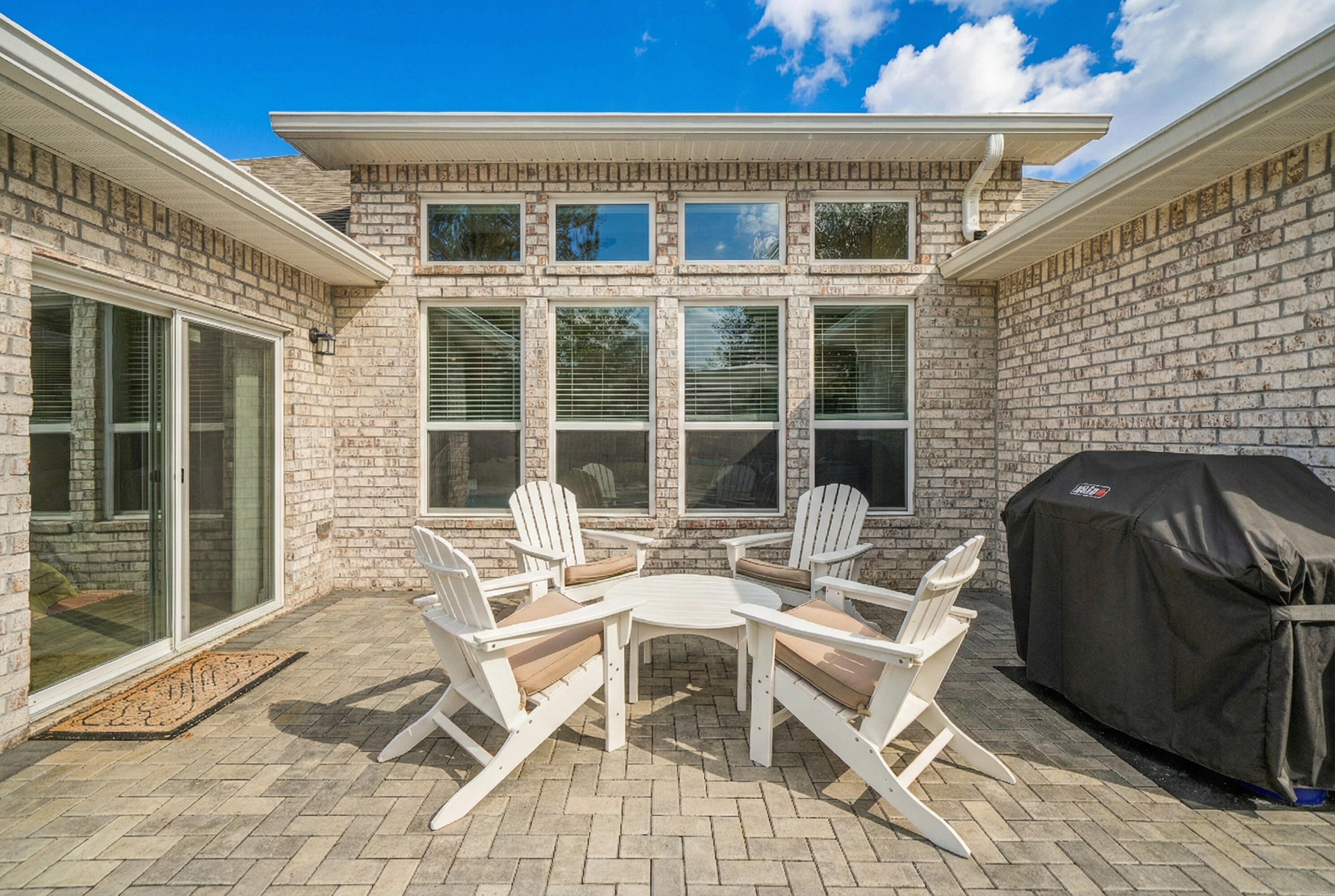 137 Autumn Avenue Freeport, FL 32439 - Photo 43 of 57 a view of a patio with a table and chairs and couches