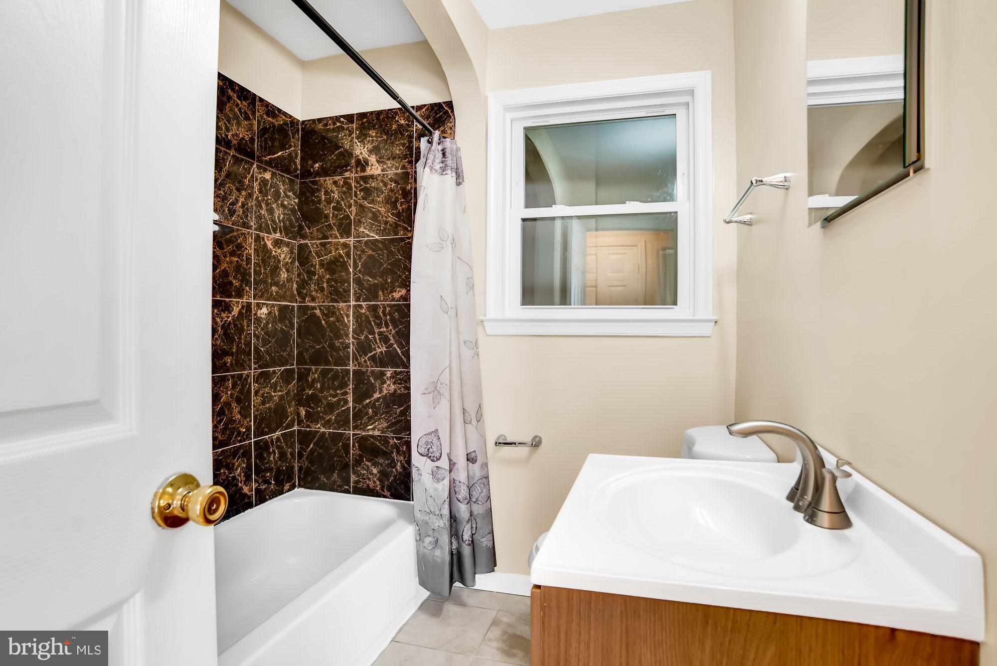 8448 Garden Road Pasadena, MD 21122 - Photo 14 of 27 Full bathroom