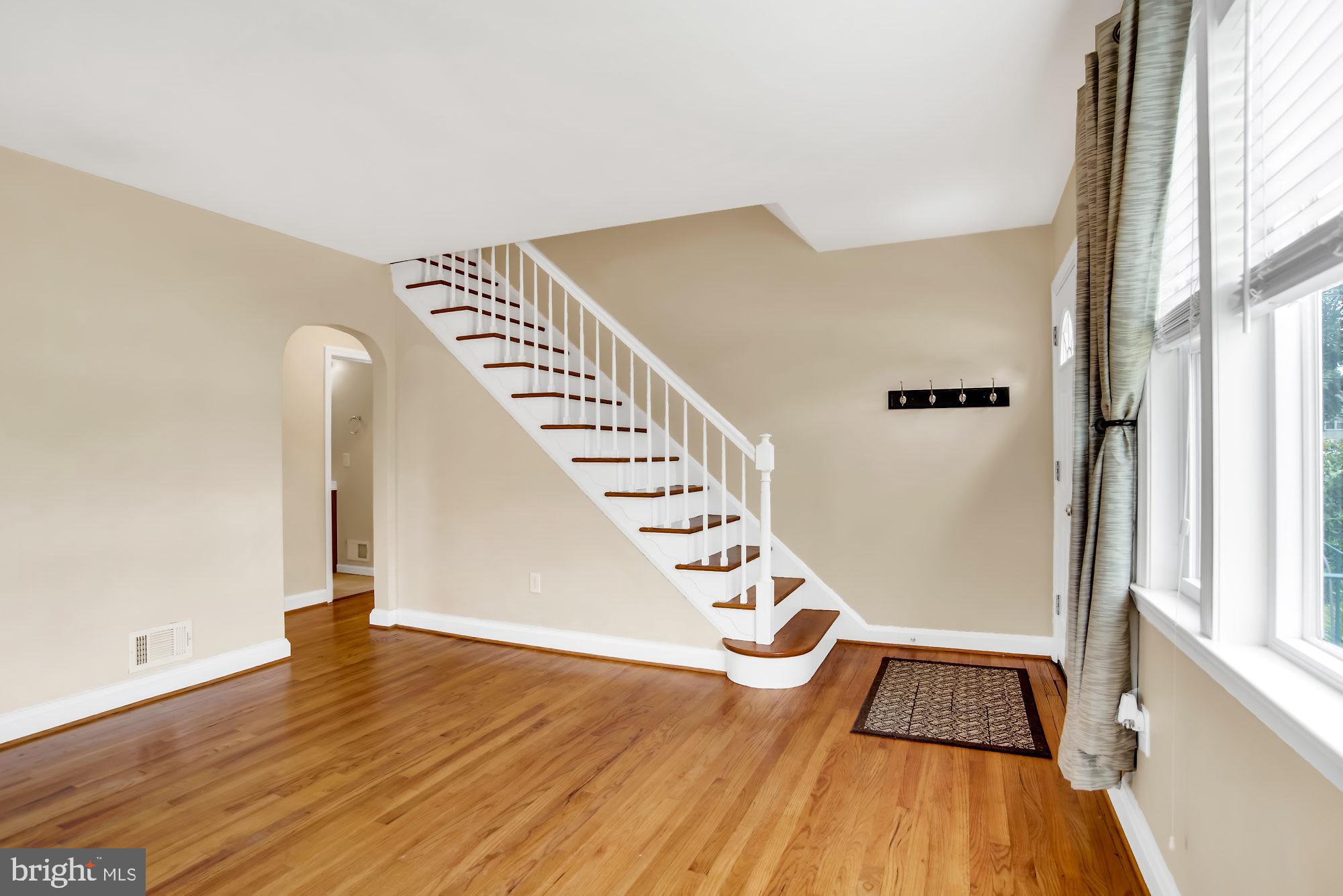8448 Garden Road Pasadena, MD 21122 - Photo 4 of 27 Spacious living room with hardwood floors