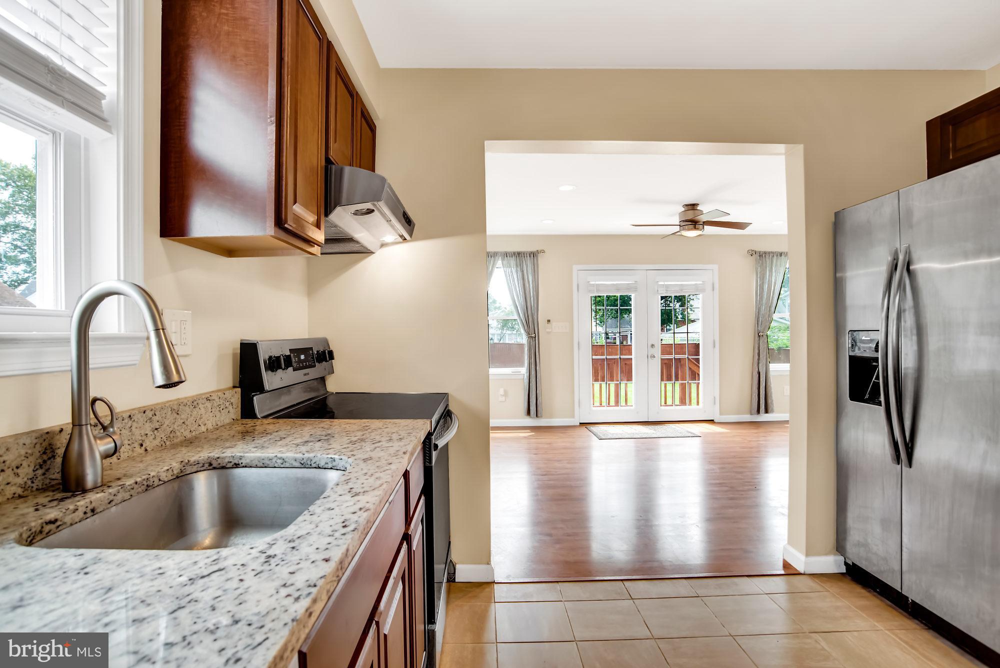 8448 Garden Road Pasadena, MD 21122 - Photo 7 of 27 kitchen with SS appliances