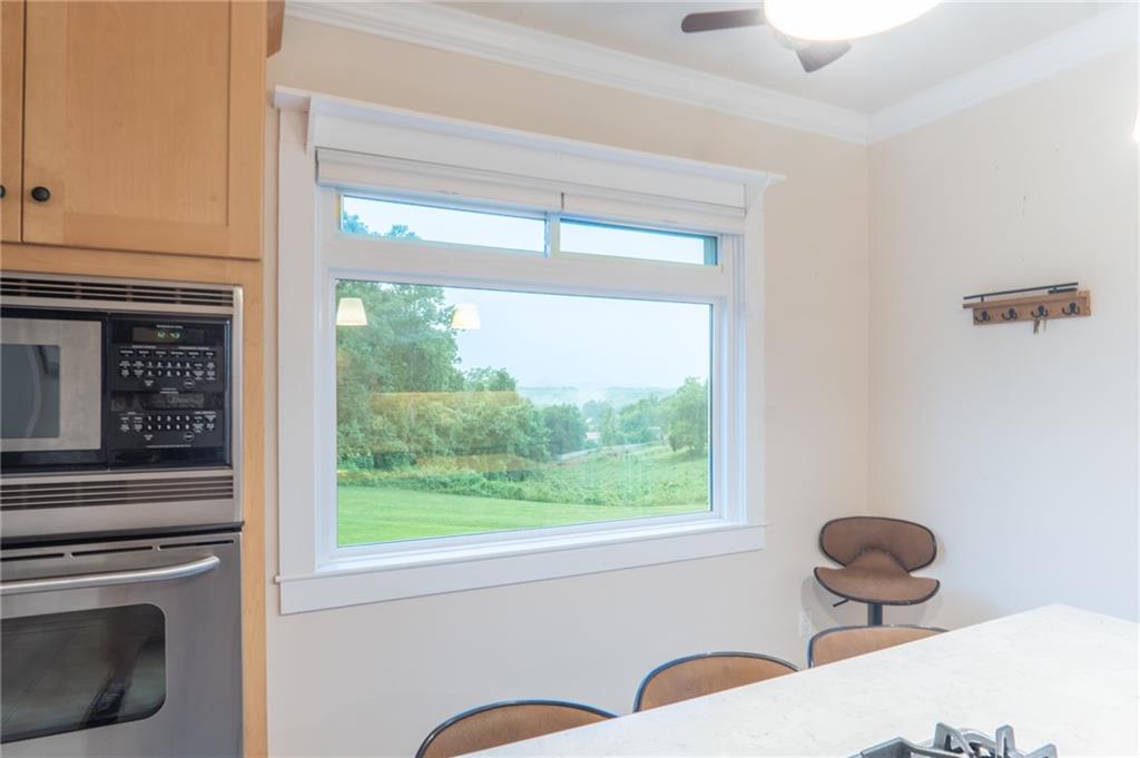 1815 Pickens Street Ball Ground, GA 30107 - Photo 2 of 38 a kitchen with a stove a refrigerator and a window