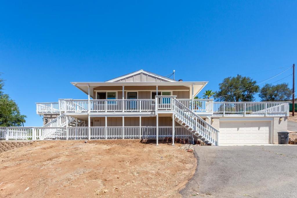 33231 Lilac Road Valley Center, CA 92082 - Photo 1 of 1 a front view of a house with a yard