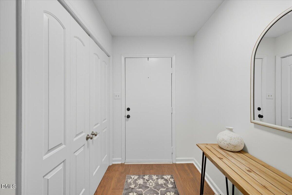 102 Choptank Court, Unit A2 Cary, NC 27513 - Photo 3 of 24 a room that has a bed and a dresser in it