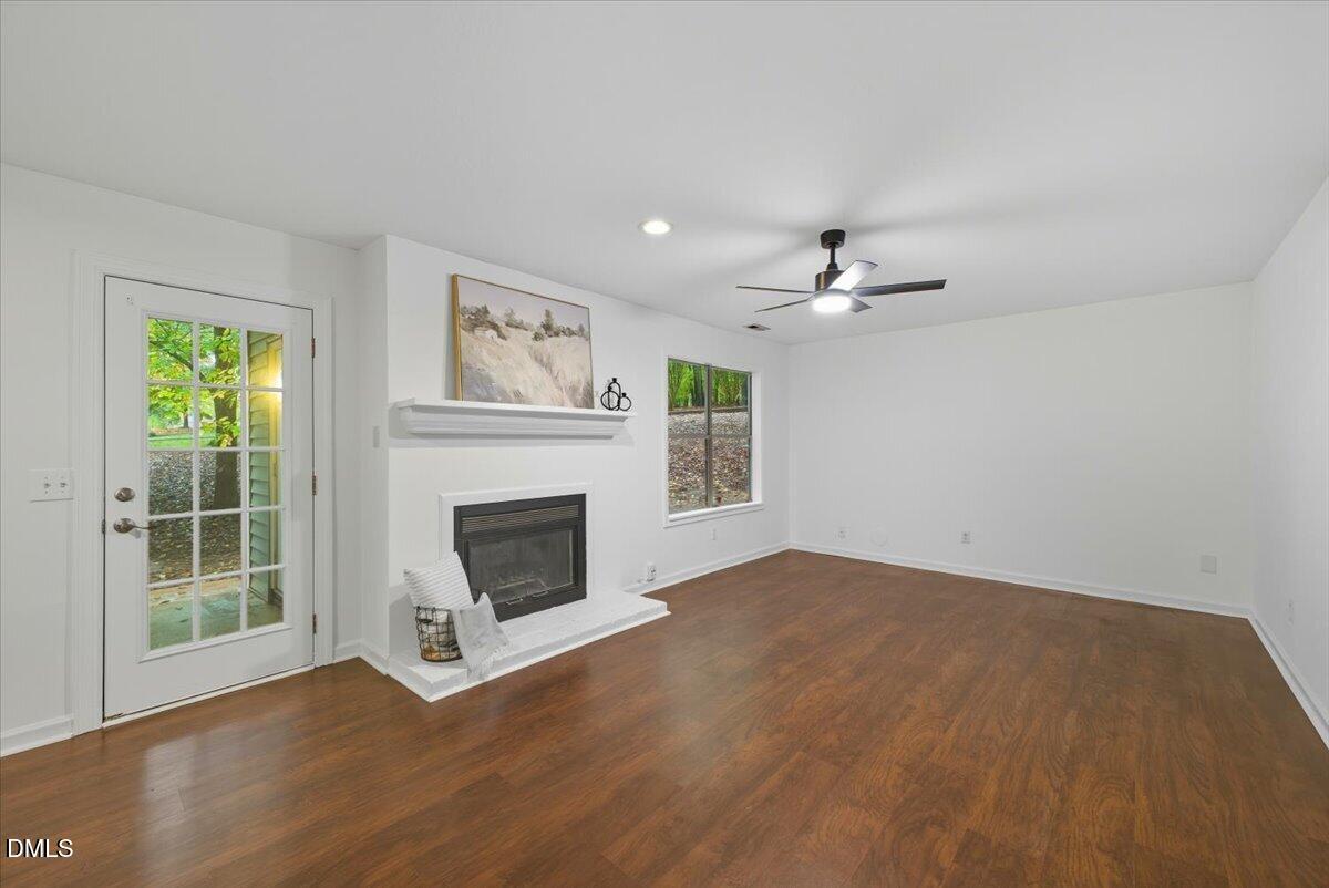 102 Choptank Court, Unit A2 Cary, NC 27513 - Photo 6 of 24 a view of a livingroom with a fireplace and window