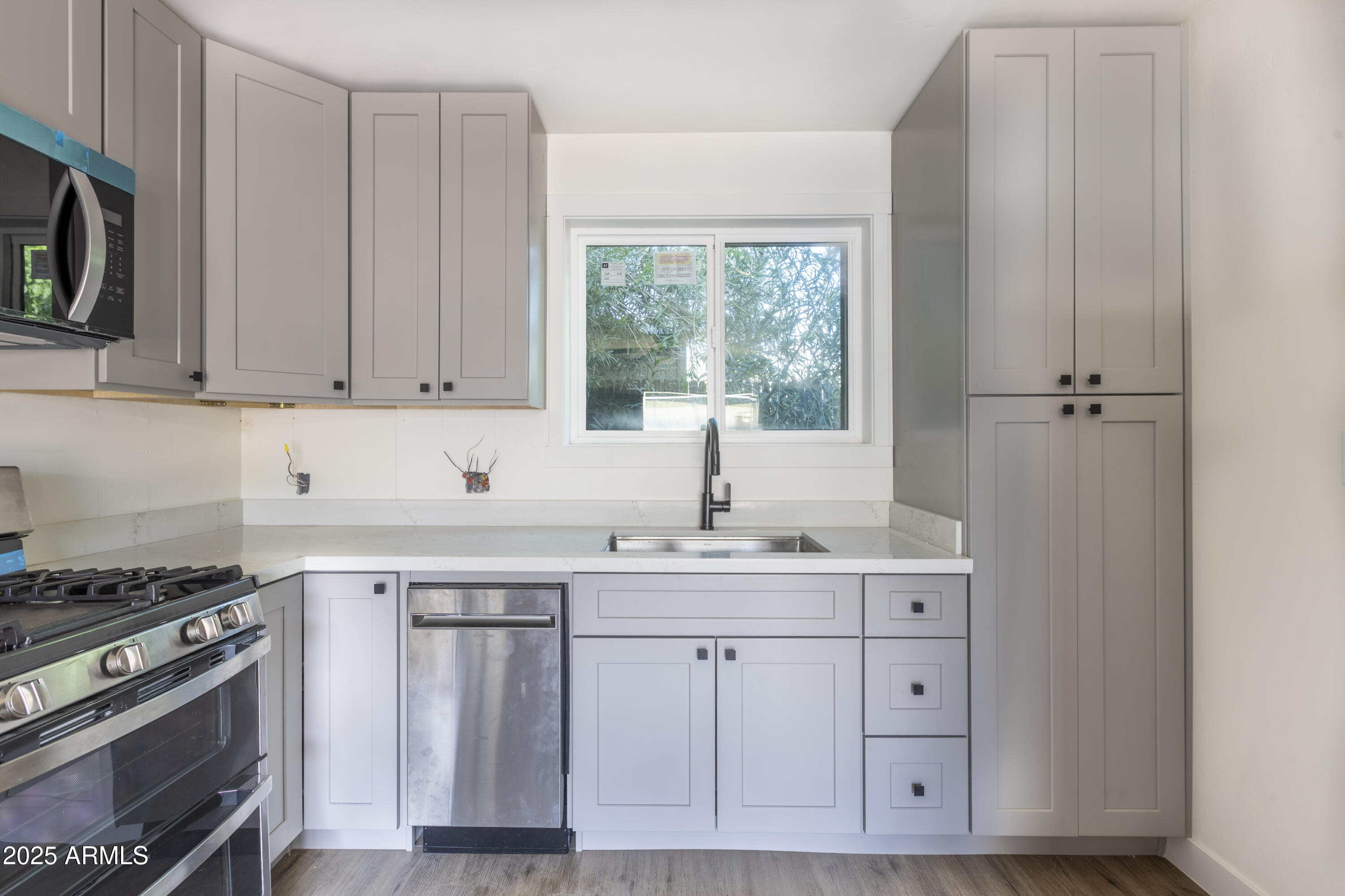 1324 East Hall Street Tempe, AZ 85281 - Photo 13 of 25 a kitchen with cabinets appliances and a window