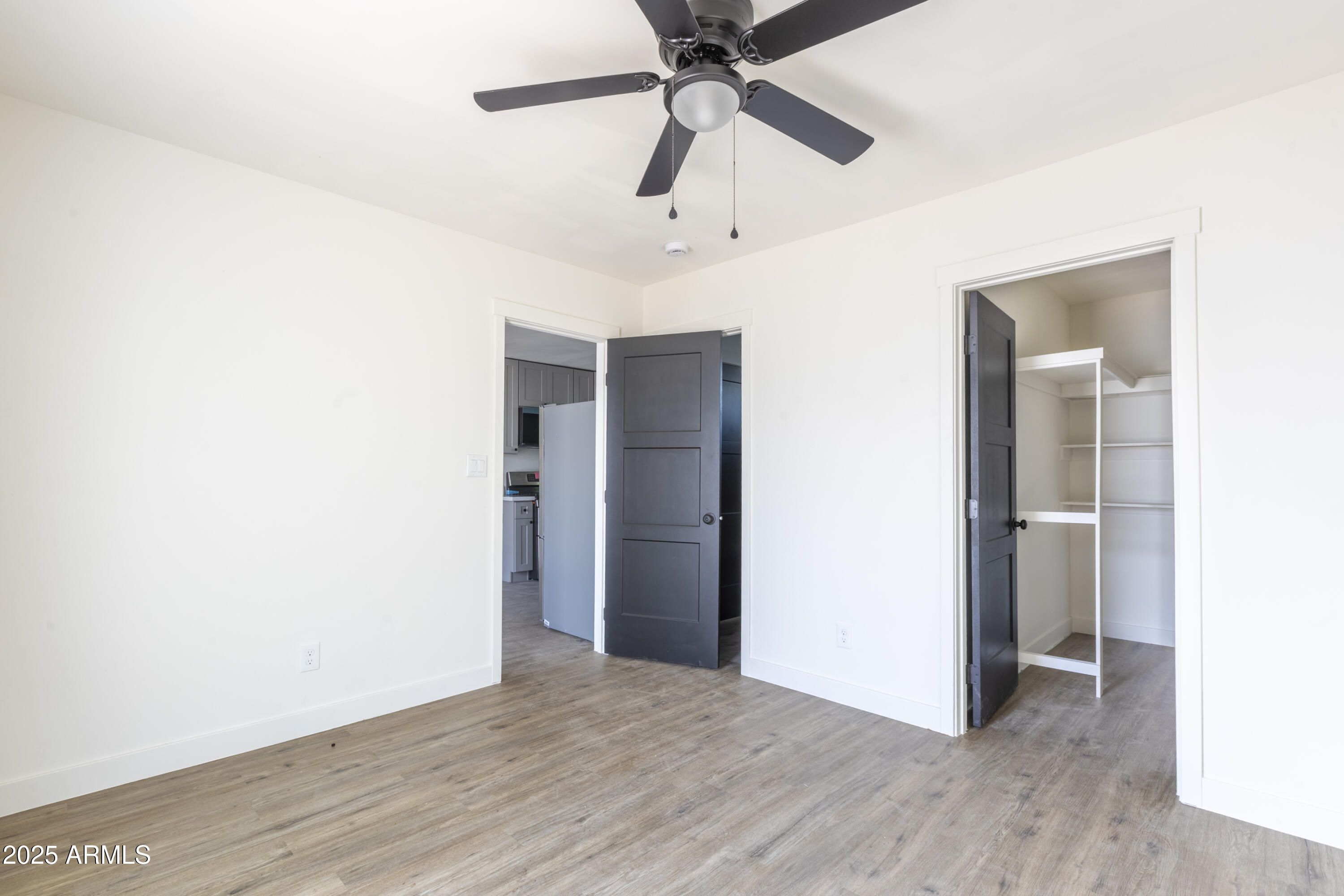 1324 East Hall Street Tempe, AZ 85281 - Photo 17 of 25 a view of an empty room with wooden floor