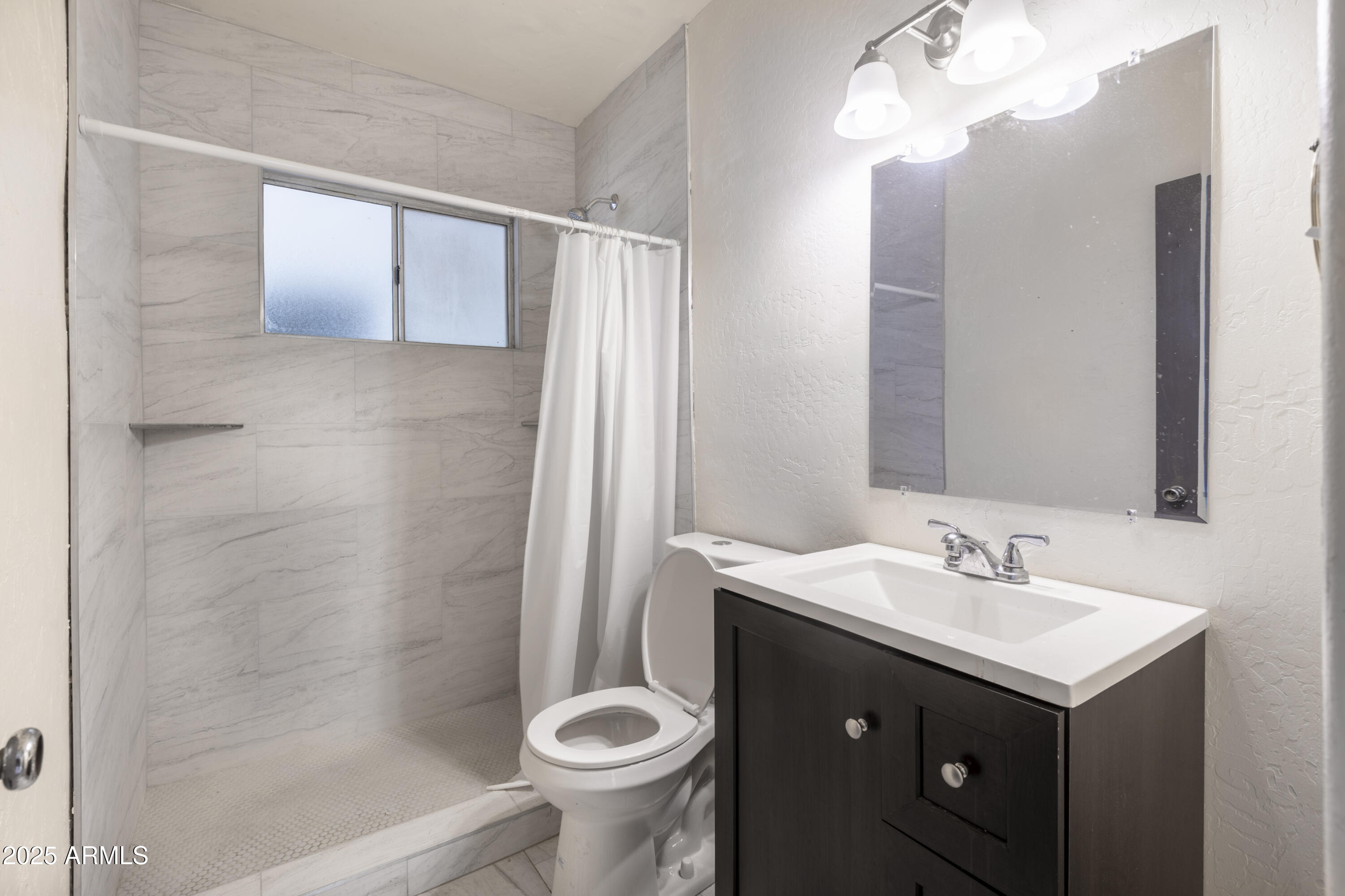 1324 East Hall Street Tempe, AZ 85281 - Photo 5 of 25 a bathroom with a sink and a mirror