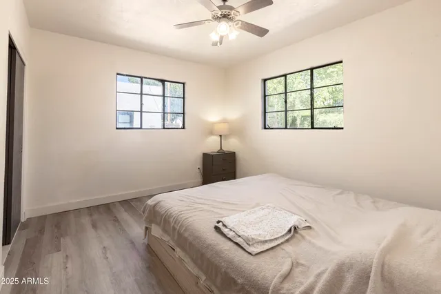 a bedroom with a bed and a window