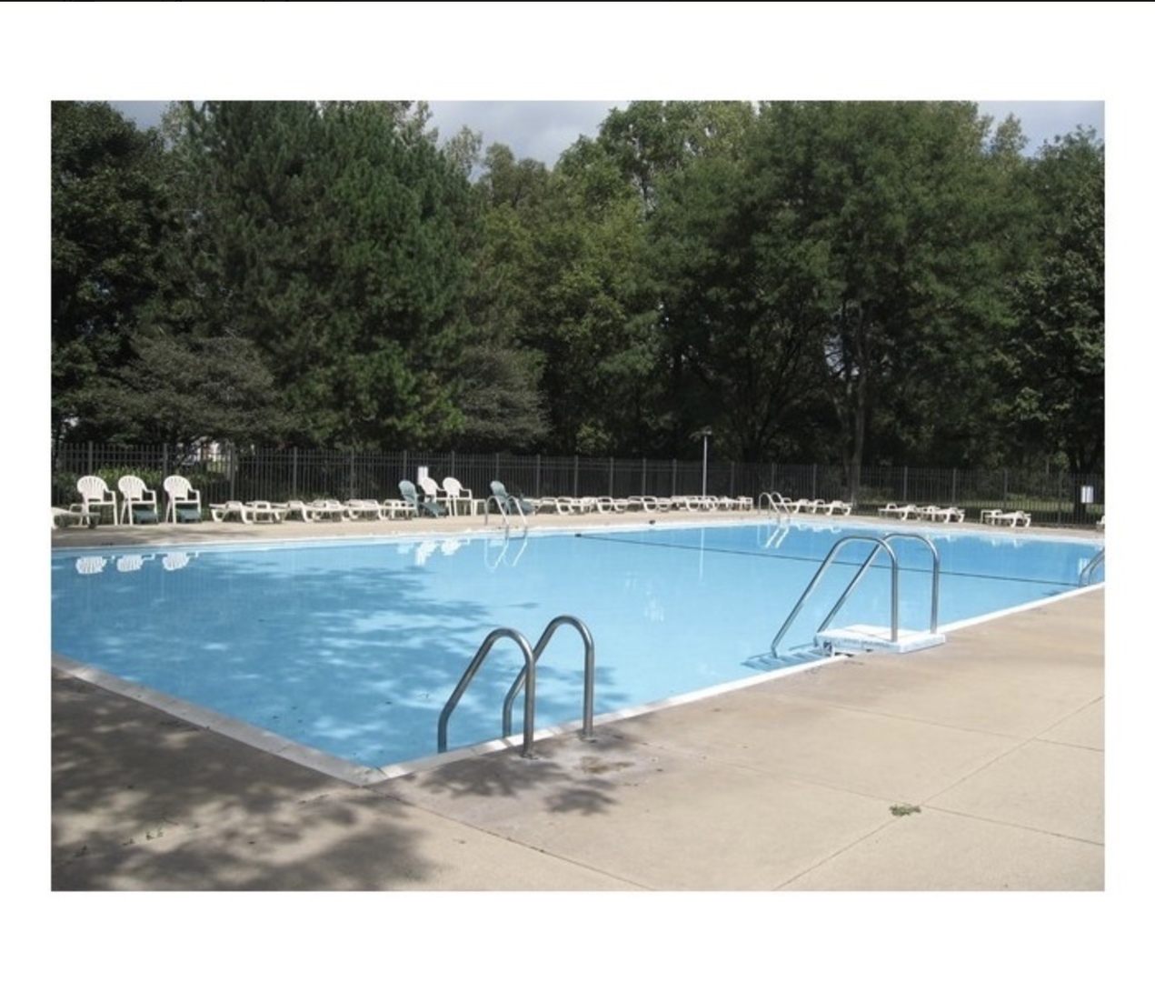 54 Oak Valley Drive Cary, IL 60013 - Photo 16 of 17 a view of a swimming pool with a yard