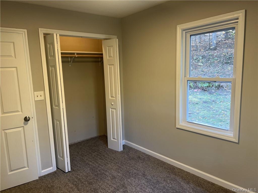 270 Benton Hollow Road Neversink, NY 12765 - Photo 14 of 21 a view of an empty room with a window