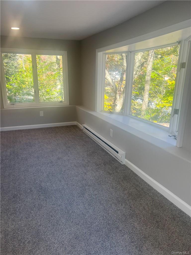 270 Benton Hollow Road Neversink, NY 12765 - Photo 8 of 21 an empty room with a window