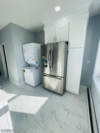 a white refrigerator freezer sitting inside of a kitchen