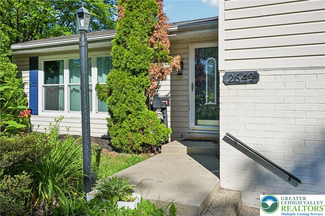 2649 Nottingham Road Bethlehem, PA 18017 - Photo 3 of 49 A welcoming entry invites with mature landscaping and a well-maintained exterior.