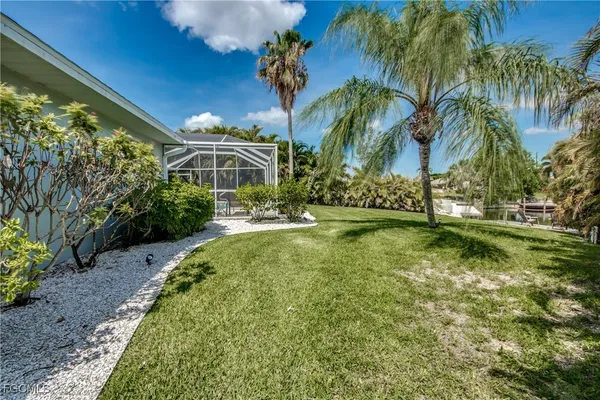 a view of a house with swimming pool garden and patio
