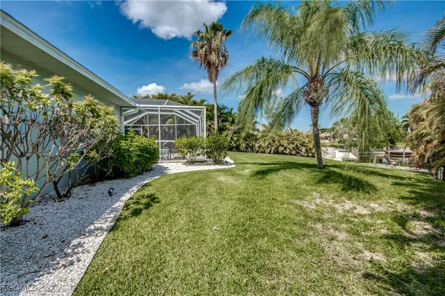 a view of a house with swimming pool garden and patio