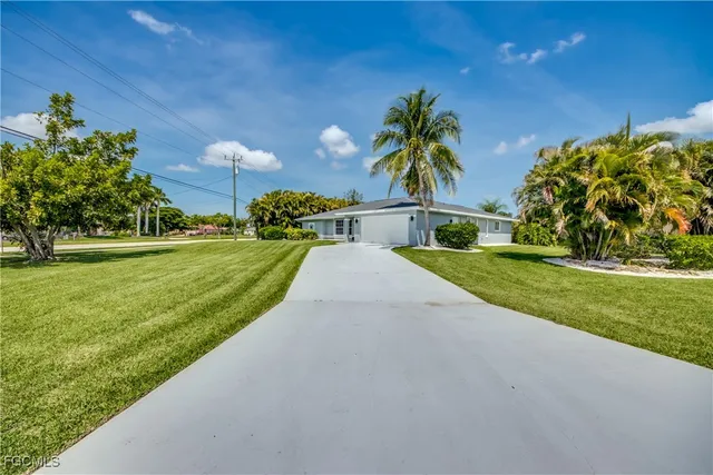 a view of a house with a back yard