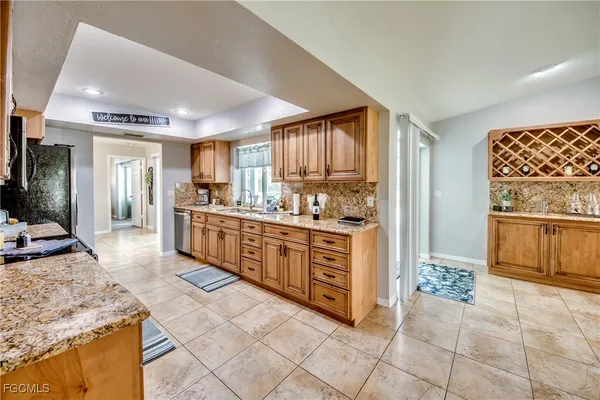 a kitchen with sink and cabinets