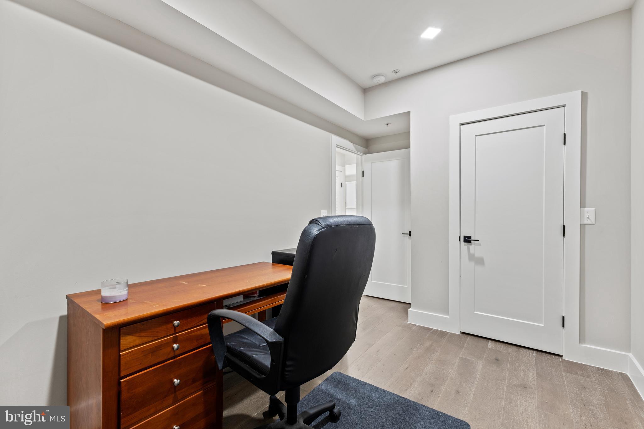 1028 Bladensburg Road Northeast, Unit 37 Washington, DC 20002 - Photo 17 of 29 a view of a workspace with furniture and wooden floor