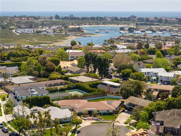 an aerial view of a city with lots of residential buildings ocean and ocean view