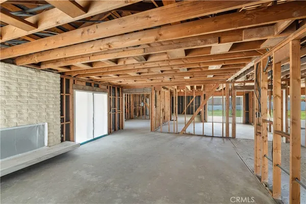 a view of an empty room with glass door