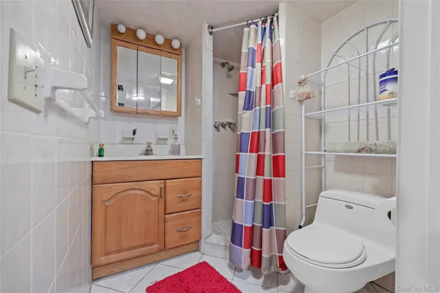 a bathroom with a sink toilet vanity and tub