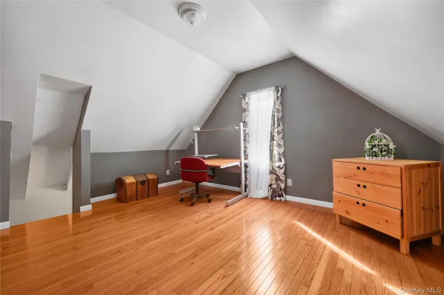 a bed room with a bed and a window