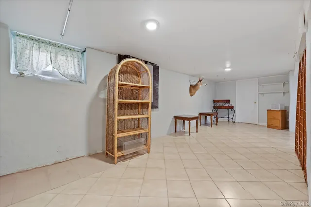 a view of a livingroom with furniture and windows