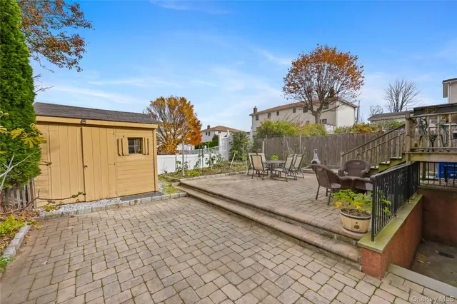 a view of a house with wooden floor and a iron fence