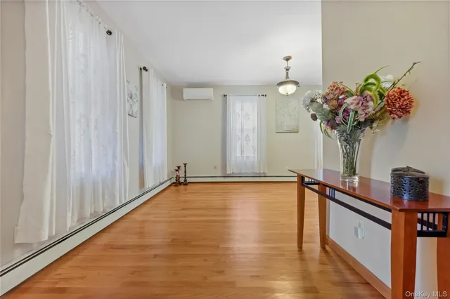 a view of a room with kitchen and front door
