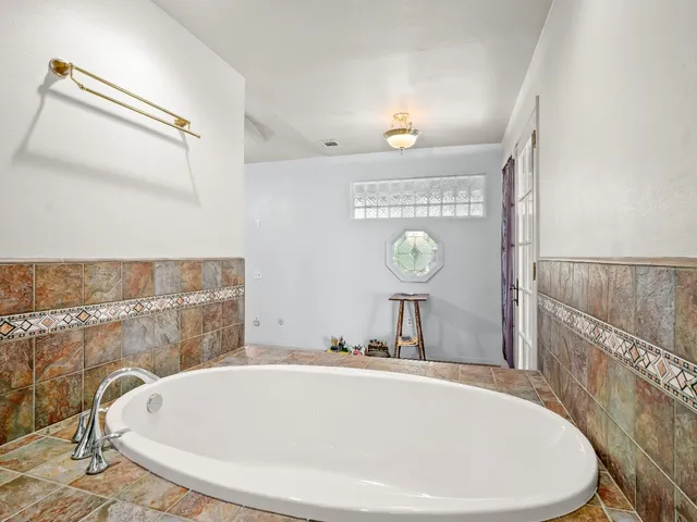 a bathroom with a glass shower door