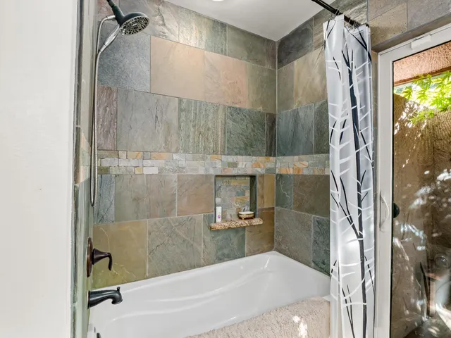 a room with a table and a potted plant