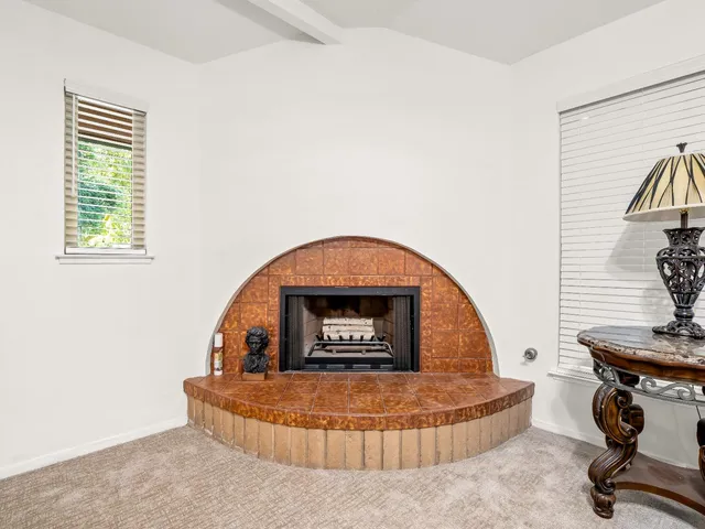 a kitchen with stainless steel appliances granite countertop a sink and cabinets with wooden floor