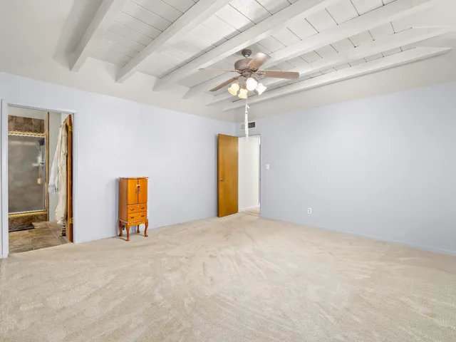 a view of a room with window and chandelier