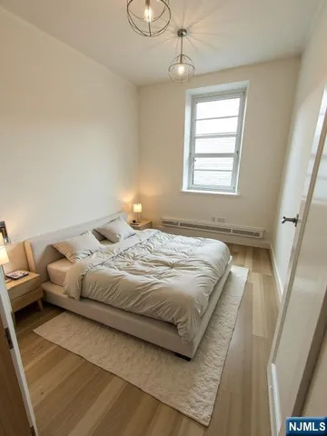 a bedroom with bed and window