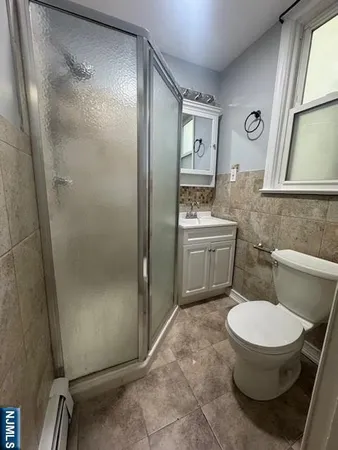 a bathroom with a toilet and a sink