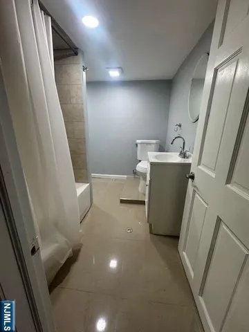 a view of a hallway with washer and dryer