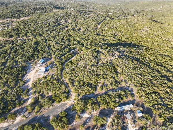 an aerial view of residential house and space