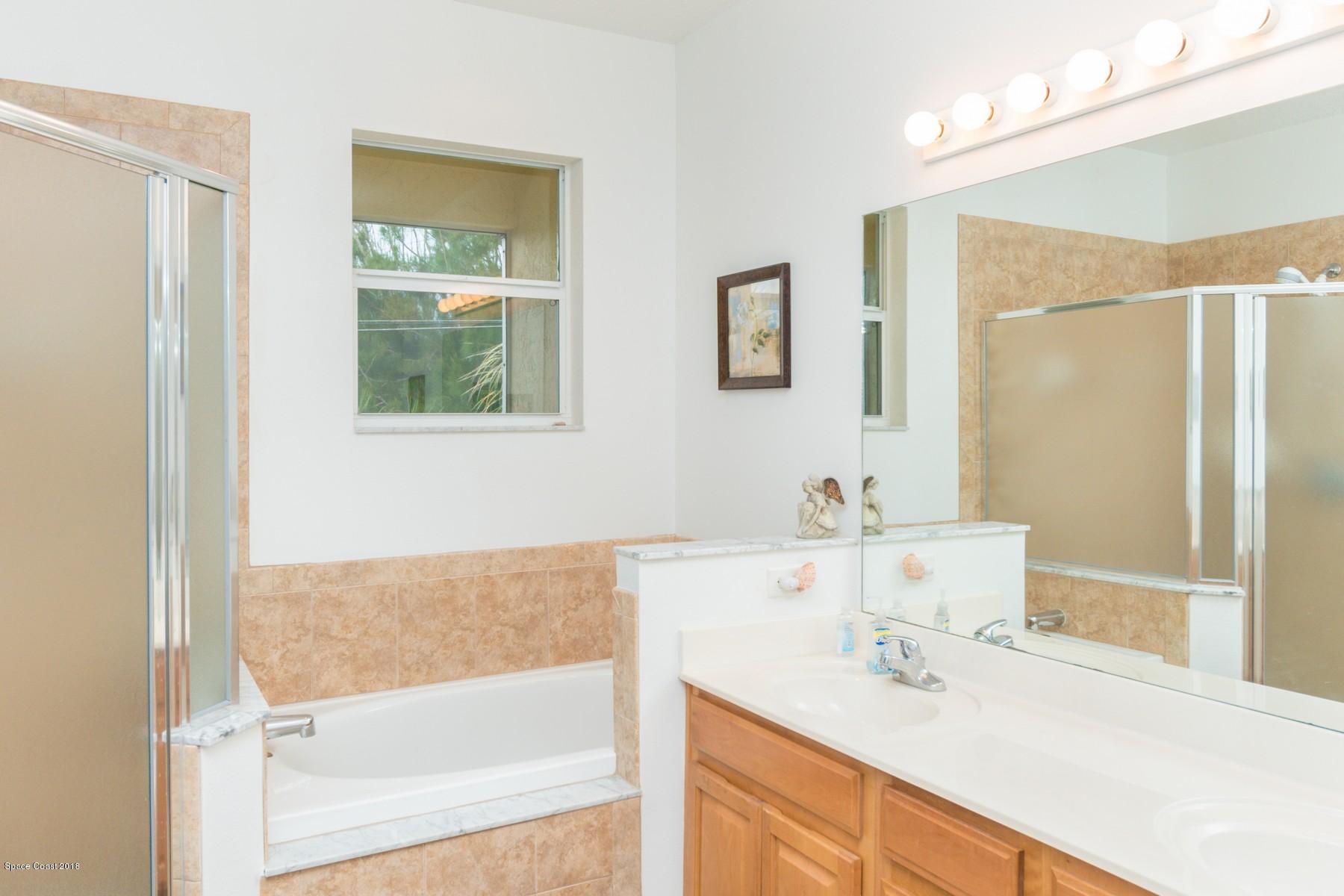 3188 Ricks Way Melbourne Beach, FL 32951 - Photo 10 of 23 Master Bath with Tub & Walk-in Shower