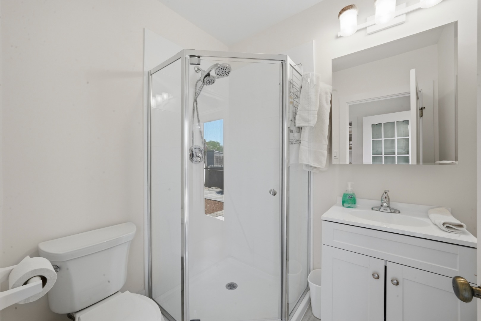 3 Newtown Road Nantucket, MA 02554 - Photo 17 of 20 a bathroom with a shower sink vanity mirror and toilet