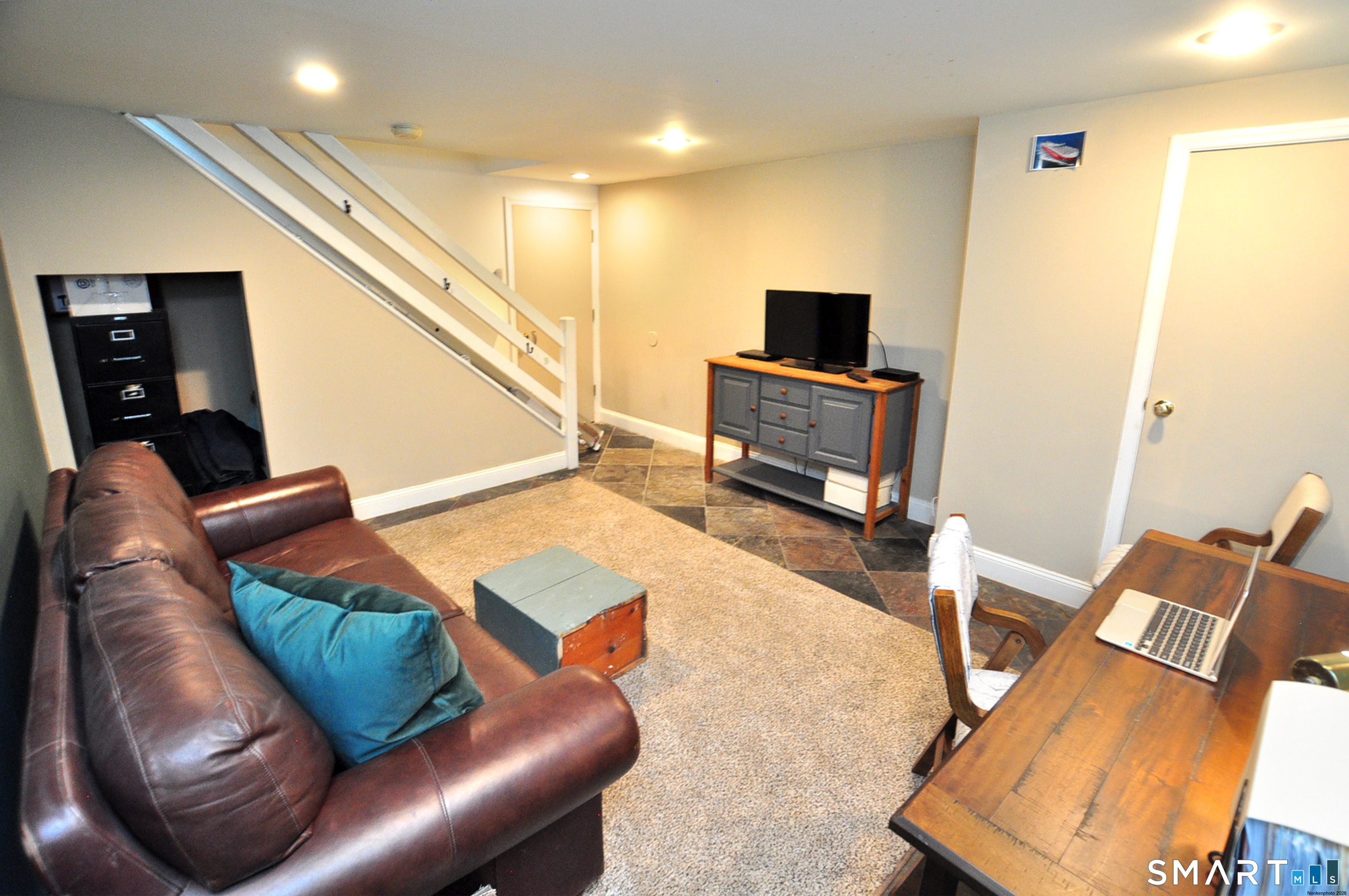 12 Revere Road Bridgewater, CT 06752 - Photo 35 of 40 a living room with furniture and a flat screen tv