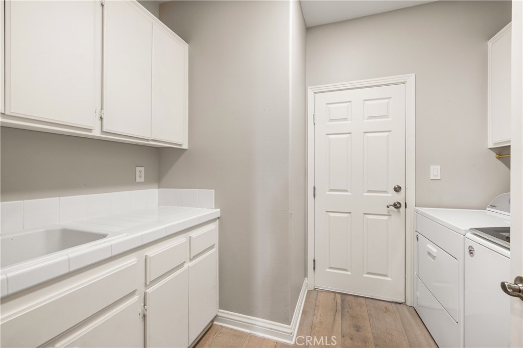 5474 Sunlight Street Simi Valley, CA 93063 - Photo 42 of 62 Interior laundry room with storage