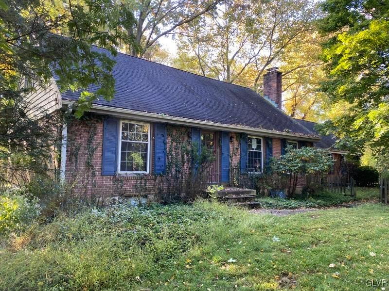 1029 Westgate Circle Bethlehem, PA 18017 - Photo 11 of 42 a front view of a house with garden