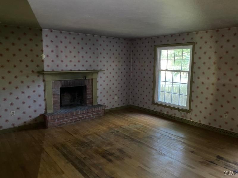 1029 Westgate Circle Bethlehem, PA 18017 - Photo 13 of 42 a view of an empty room with wooden floor and a fireplace
