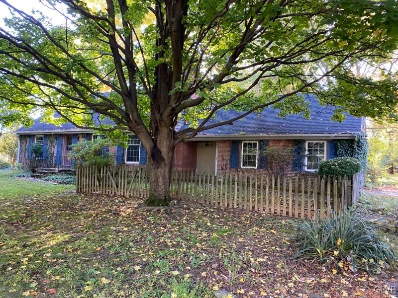 1029 Westgate Circle Bethlehem, PA 18017 - Photo 2 of 42 a front view of a house with a garden